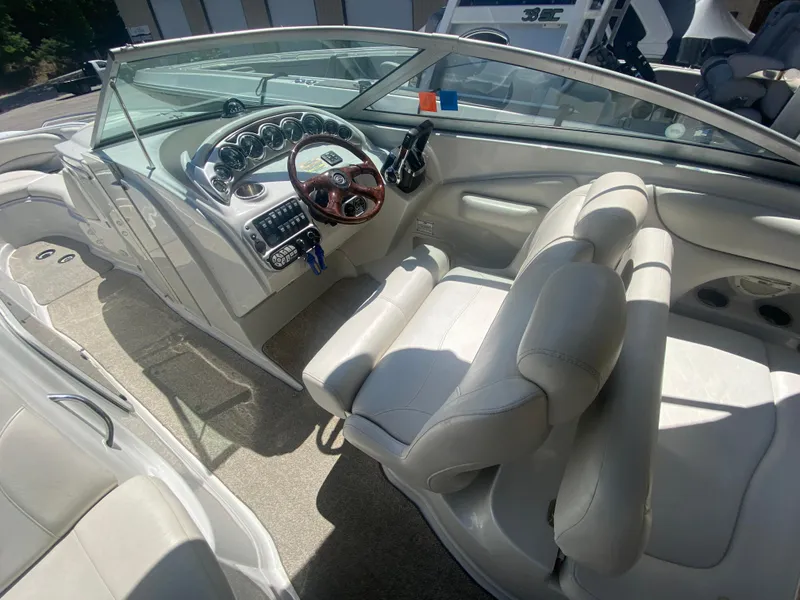 Slide: The Image of 2006 Crownline 320 LS boat interior with steering wheel and dashboard controls. - 21