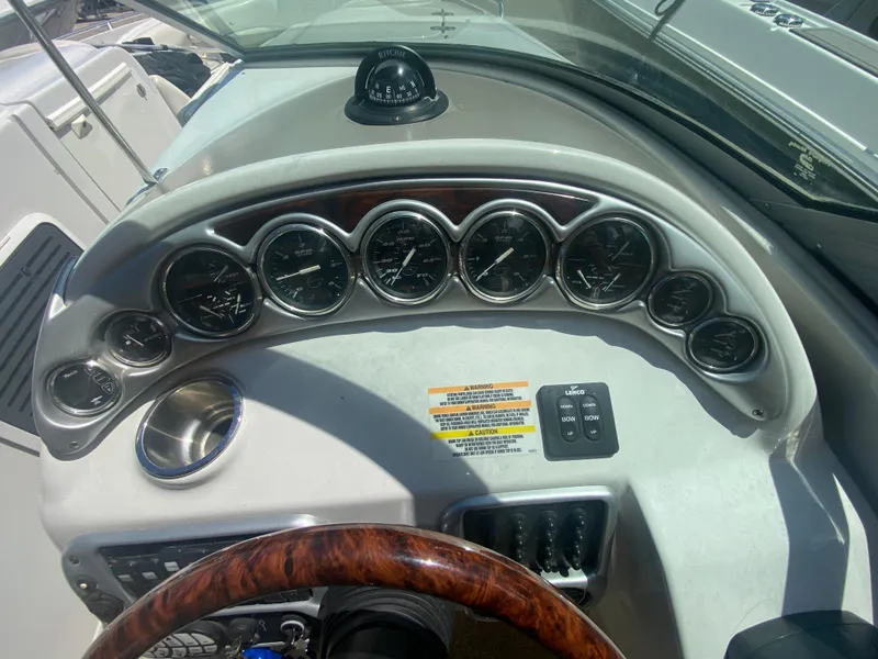 Slide: The Image of Dashboard of a 2006 Crownline 320 LS boat with gauges and controls. - 24