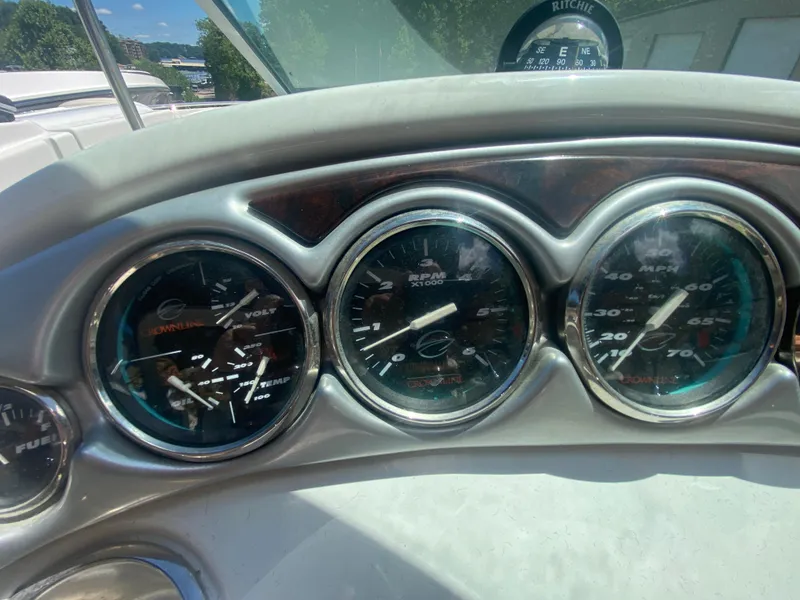 Slide: The Image of Dashboard of a 2006 Crownline 320 LS boat with gauges and compass. - 25