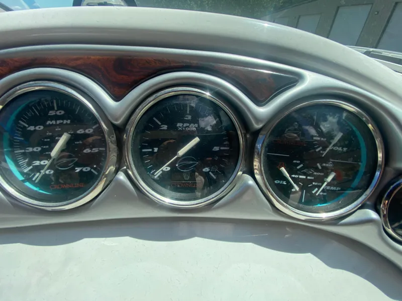 Slide: The Image of Dashboard gauges of a 2006 Crownline 320 LS boat, displaying speed, RPM, and engine metrics. - 26