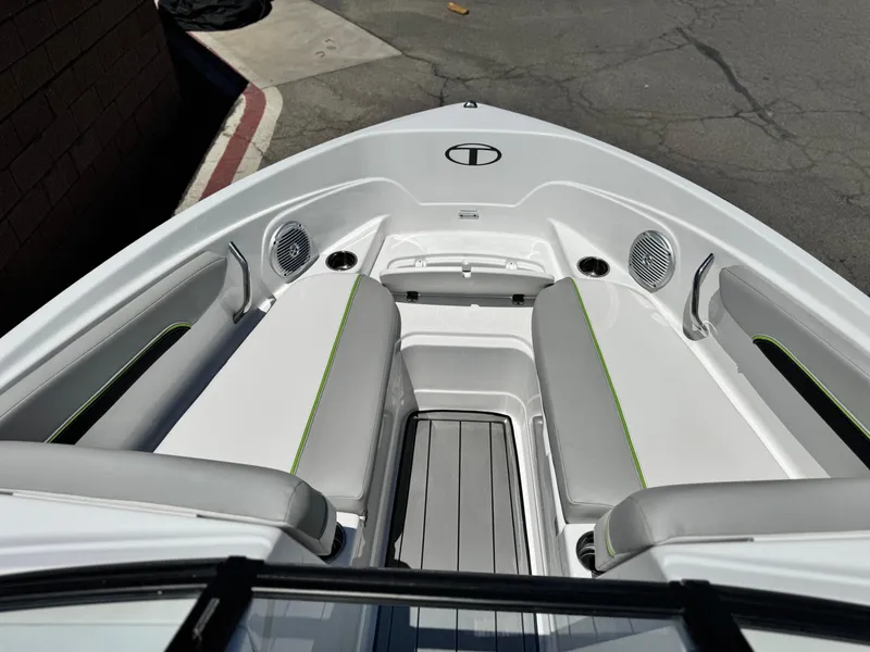 Slide: The Image of 2023 Tahoe 210 Si boat interior with gray seating and green accents. - 10