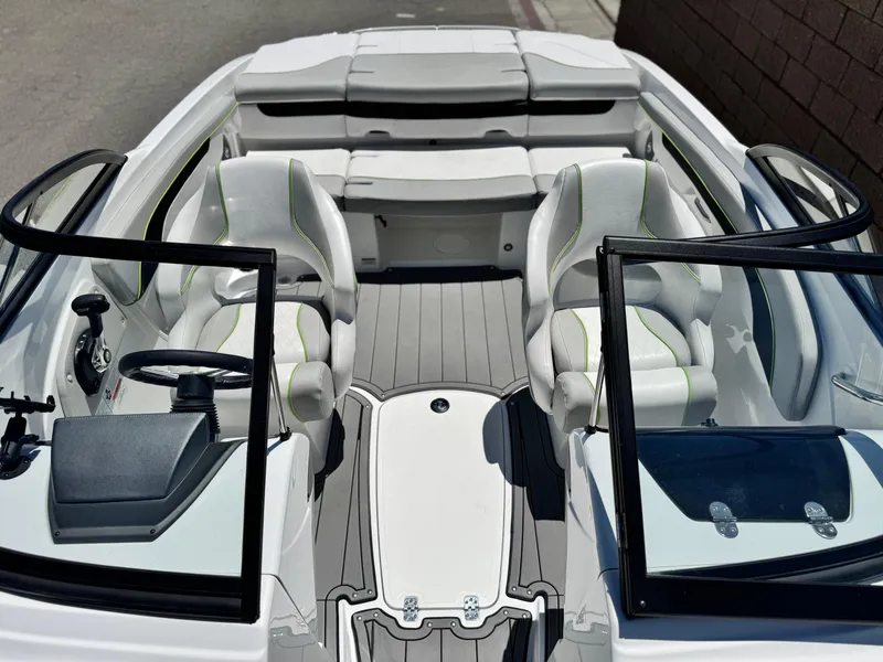 Slide: The Image of 2023 Tahoe 210 Si boat interior with modern seating and sleek design. - 13