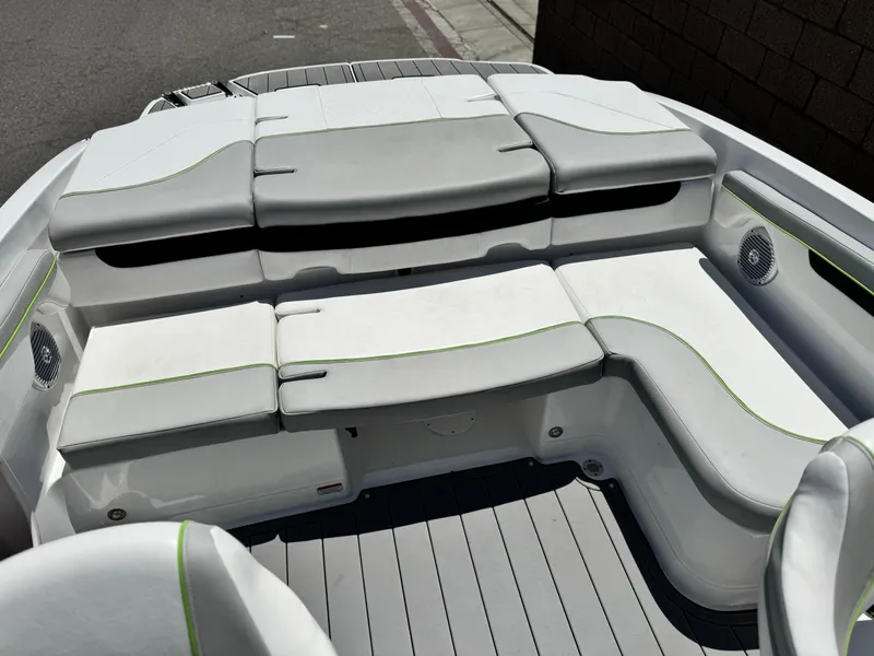 Slide: The Image of 2023 Tahoe 210 Si boat interior with cushioned seating and modern design. - 14