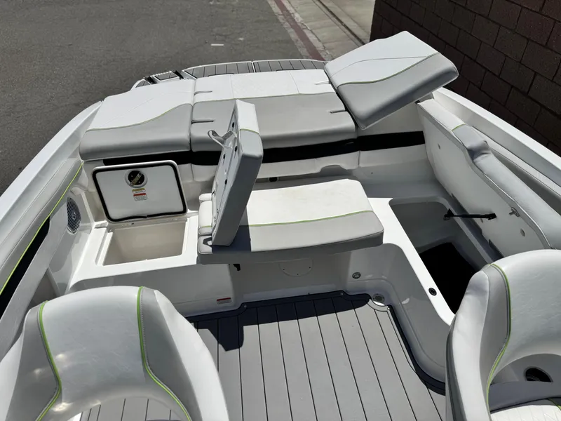 Slide: The Image of 2023 Tahoe 210 Si boat interior with gray seating and storage compartments. - 15