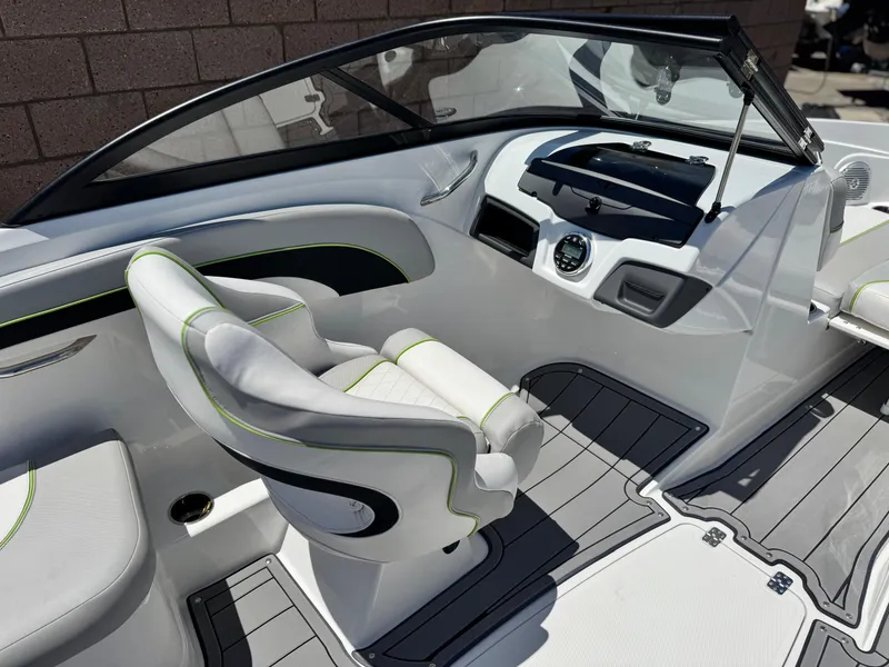 Slide: The Image of 2023 Tahoe 210 Si boat interior with modern dashboard and sleek seating design. - 19