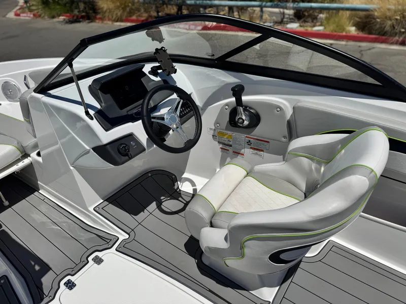 Slide: The Image of 2023 Tahoe 210 Si boat interior with modern steering and seating. - 21