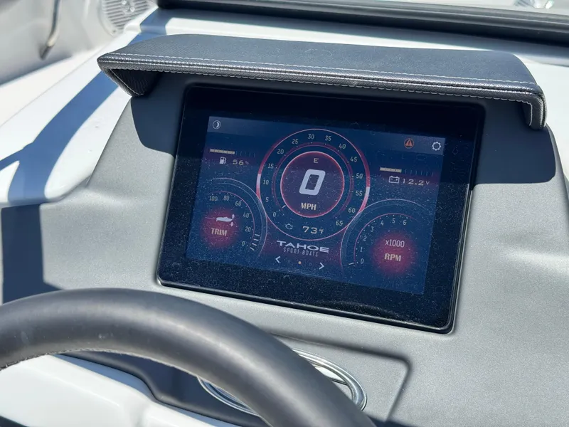 Slide: The Image of Dashboard of 2023 Tahoe 210 Si boat showing speedometer and RPM gauges. - 24
