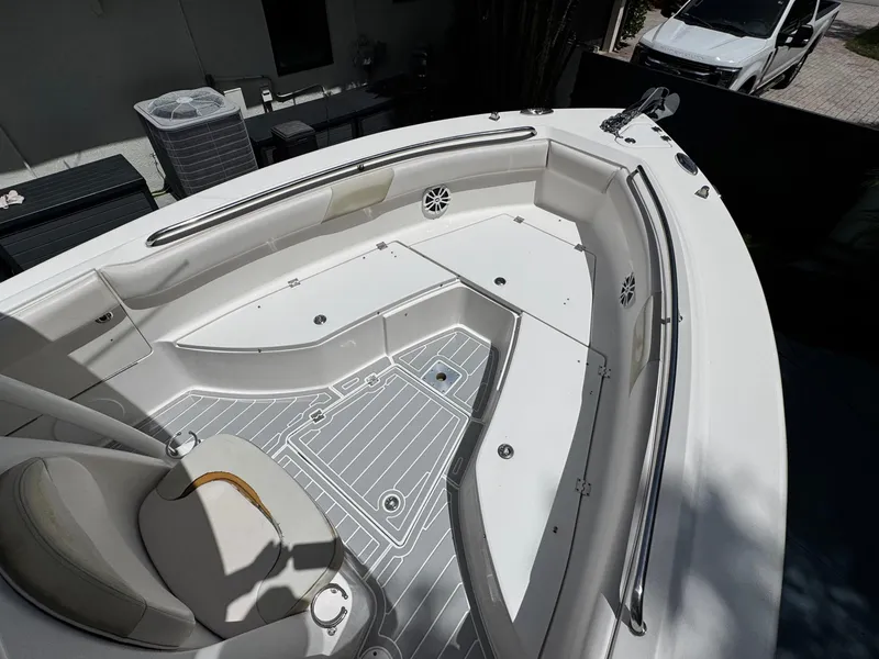 Slide: The Image of 2016 Robalo R260 Center Console boat interior with seating and storage compartments. - 14