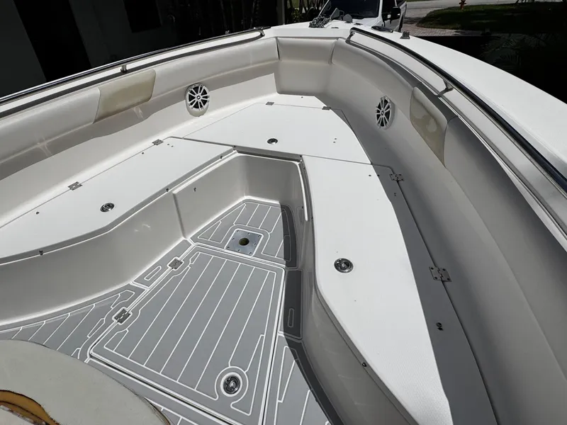Slide: The Image of 2016 Robalo R260 Center Console boat interior with spacious seating and storage compartments. - 15
