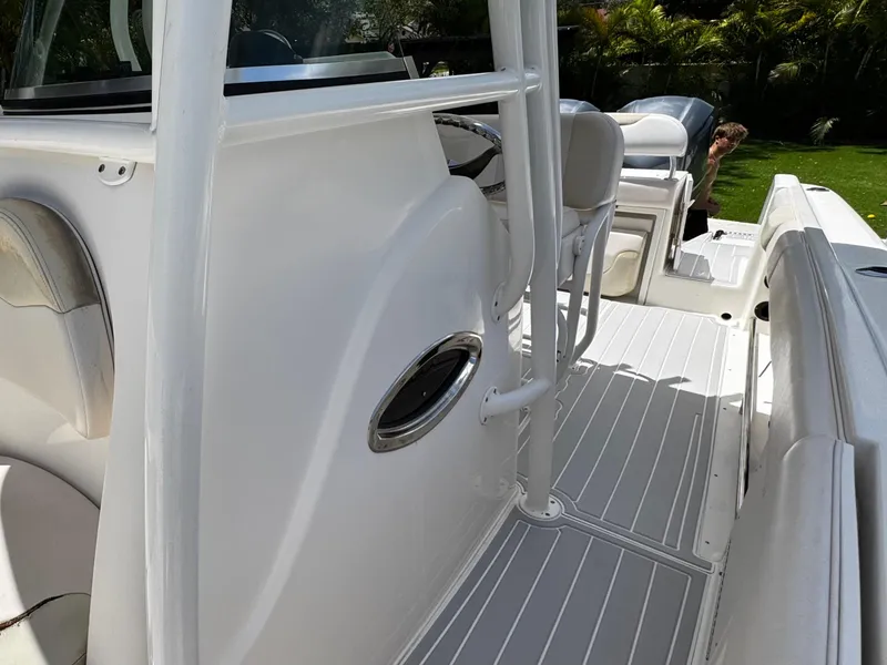 Slide: The Image of 2016 Robalo R260 Center Console boat interior with seating and console details. - 19