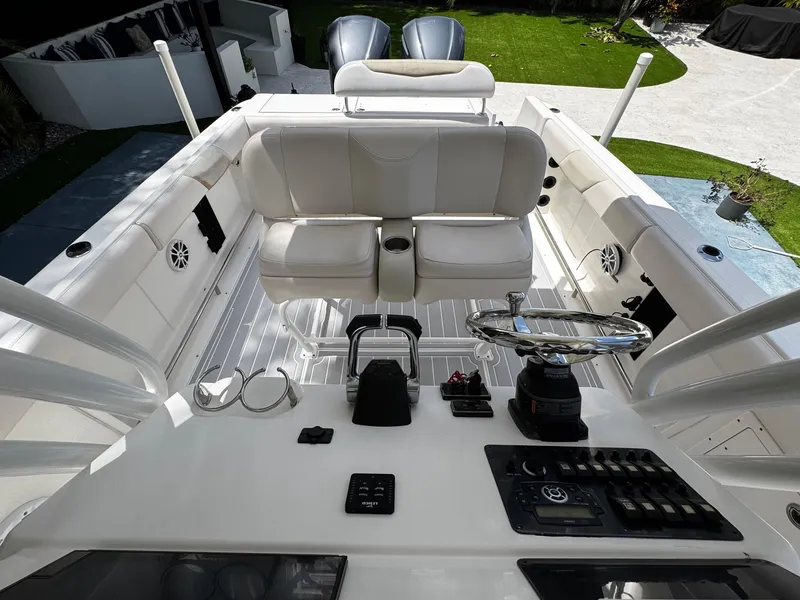 Slide: The Image of 2016 Robalo R260 Center Console boat interior with steering wheel and seating. - 21