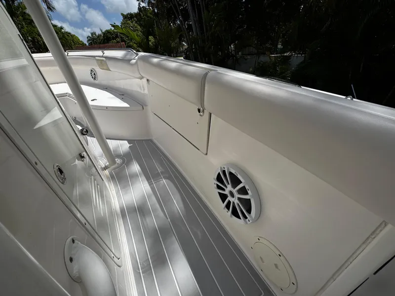 Slide: The Image of 2016 Robalo R260 Center Console boat interior with speaker and storage compartment. - 26