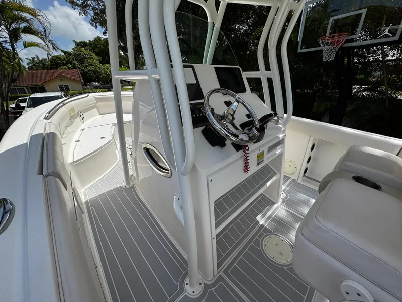 Slide: The Image of 2016 Robalo R260 Center Console boat interior with steering wheel and seating. - 32