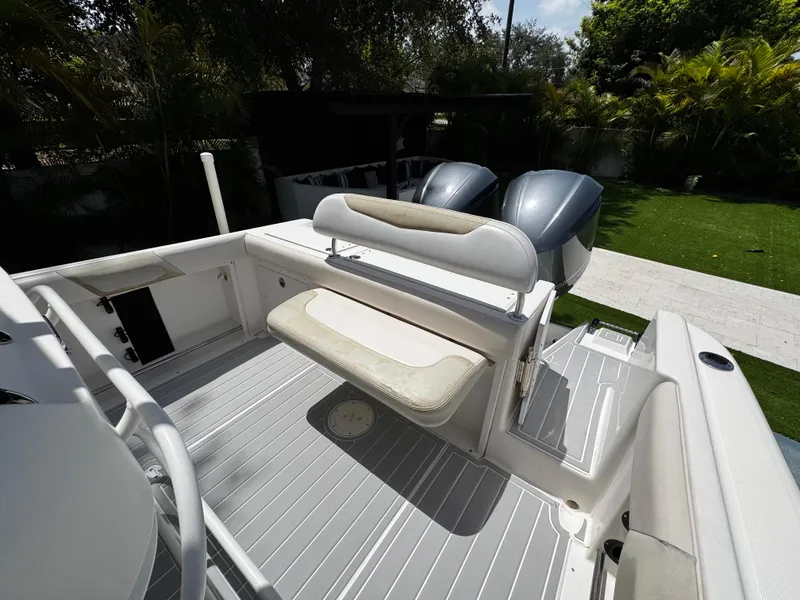 Slide: The Image of 2016 Robalo R260 Center Console boat with dual engines and seating area. - 37