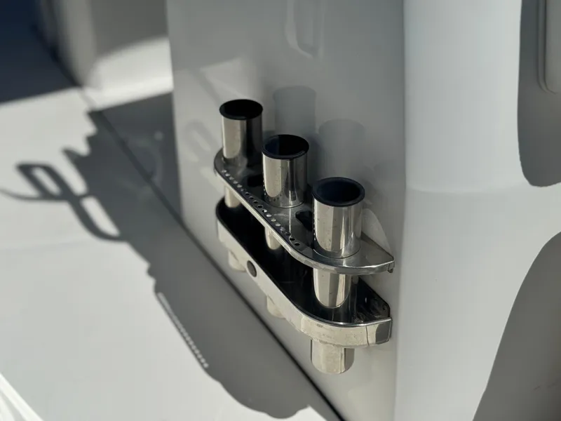 Slide: The Image of Rod holders on a 2017 Edgewater 170CC boat, showcasing sleek stainless steel design. - 11