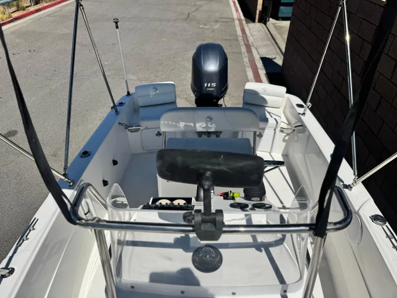 Slide: The Image of 2017 Edgewater 170CC boat with Yamaha 115 engine, parked on a street. - 12