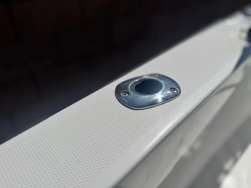 Slide: The Image of Close-up of 2017 Edgewater 170CC boat's metal fitting on textured surface. - 18
