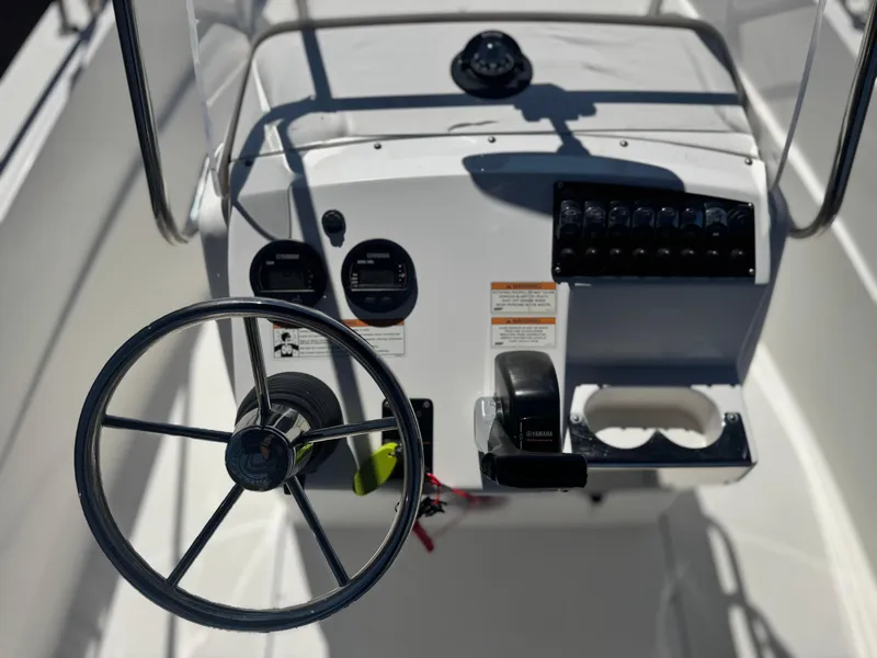 Slide: The Image of Edgewater 170CC 2017 boat console with steering wheel and controls. - 22