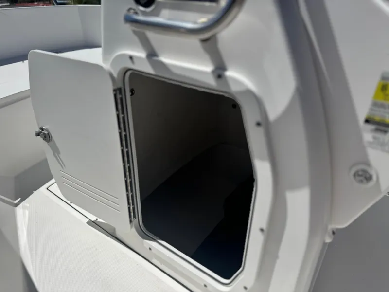 Slide: The Image of Open storage compartment on a 2017 Edgewater 170CC boat. - 27