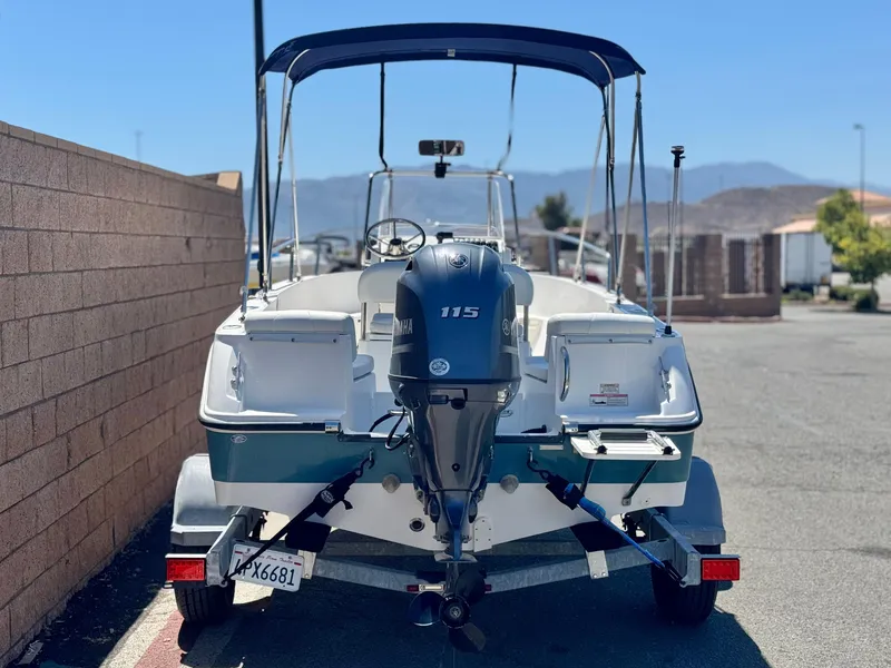 Slide: The Image of 2017 Edgewater 170CC boat with Yamaha 115 engine, parked on a trailer. - 4