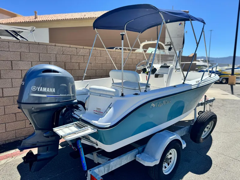 Slide: The Image of 2017 Edgewater 170CC boat with Yamaha motor on trailer, parked outdoors. - 5