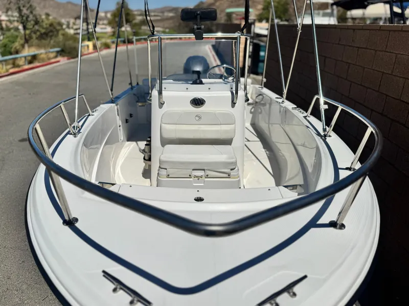 Slide: The Image of 2017 Edgewater 170CC boat with sleek design, white interior, and stainless steel railings. - 7