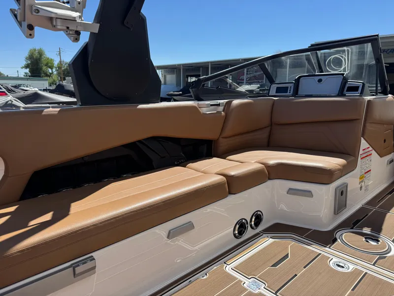 Slide: The Image of 2021 Supra SL 550 boat interior with tan leather seating and modern dashboard. - 6