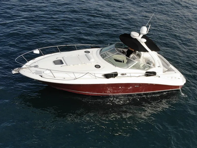 The Image of 2006 Sea Ray 340 Sundancer yacht anchored in scenic coastal waters. - 0