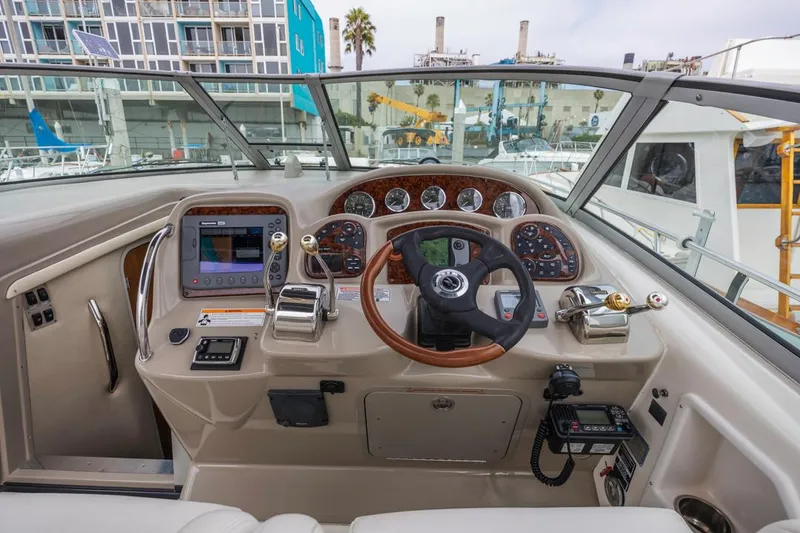 Slide: The Image of Helm of 2006 Sea Ray 340 Sundancer with modern controls and navigation equipment. - 14