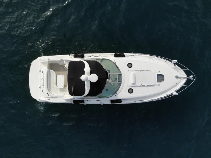 Slide: The Image of Aerial view of 2006 Sea Ray 340 Sundancer yacht on open water. - 2