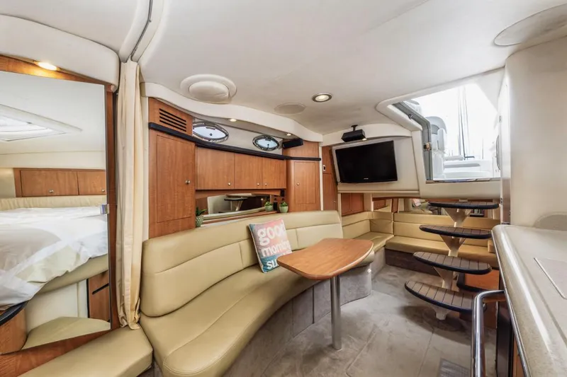 Slide: The Image of Luxurious interior of 2006 Sea Ray 340 Sundancer yacht with cozy seating and modern amenities. - 26