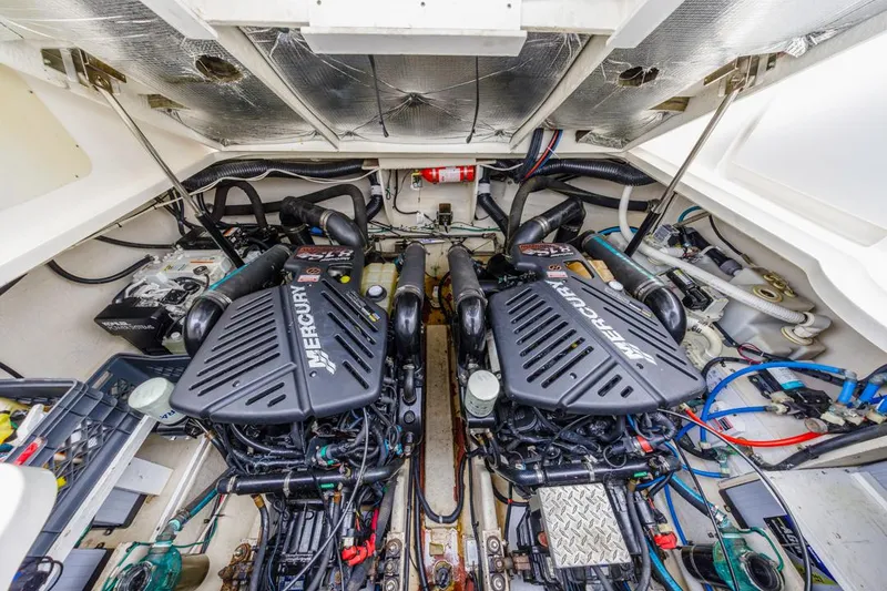 Slide: The Image of Engine room of 2006 Sea Ray 340 Sundancer with twin Mercury engines. - 29