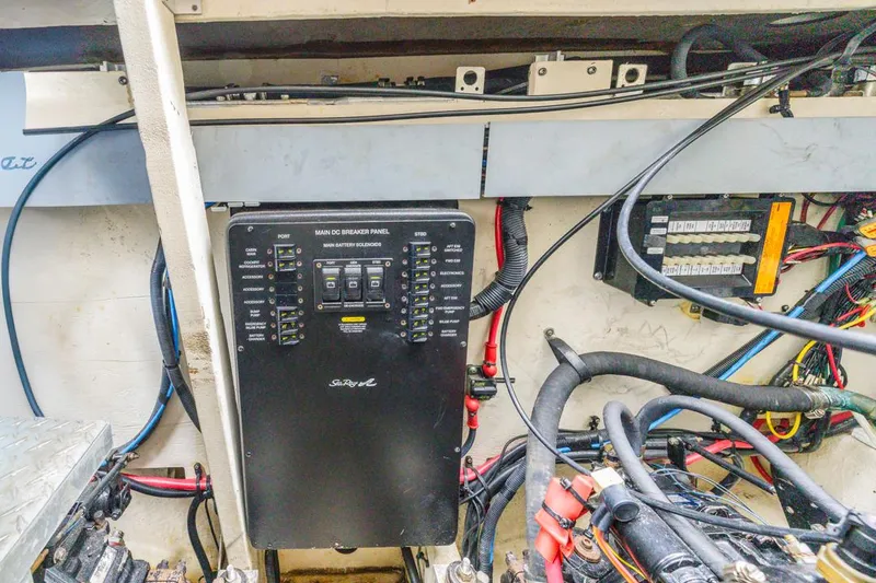 Slide: The Image of Electrical panel of a 2006 Sea Ray 340 Sundancer boat, showing wiring and components. - 31