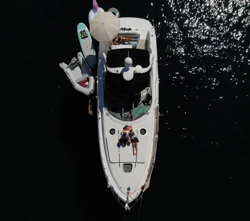 Slide: The Image of Aerial view of 2006 Sea Ray 340 Sundancer yacht with sunbathers and paddleboards. - 5
