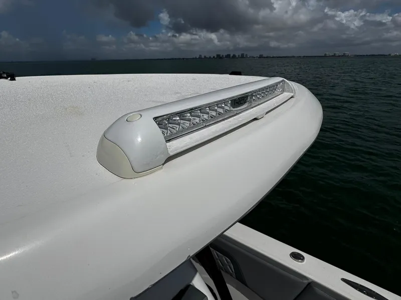 Slide: The Image of 2023 Avanti 36 boat with LED light bar on deck, ocean background. - 13