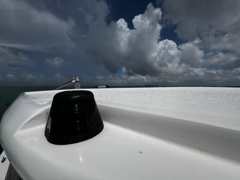 Slide: The Image of 2023 Avanti 36 boat deck with navigation light under cloudy sky. - 14