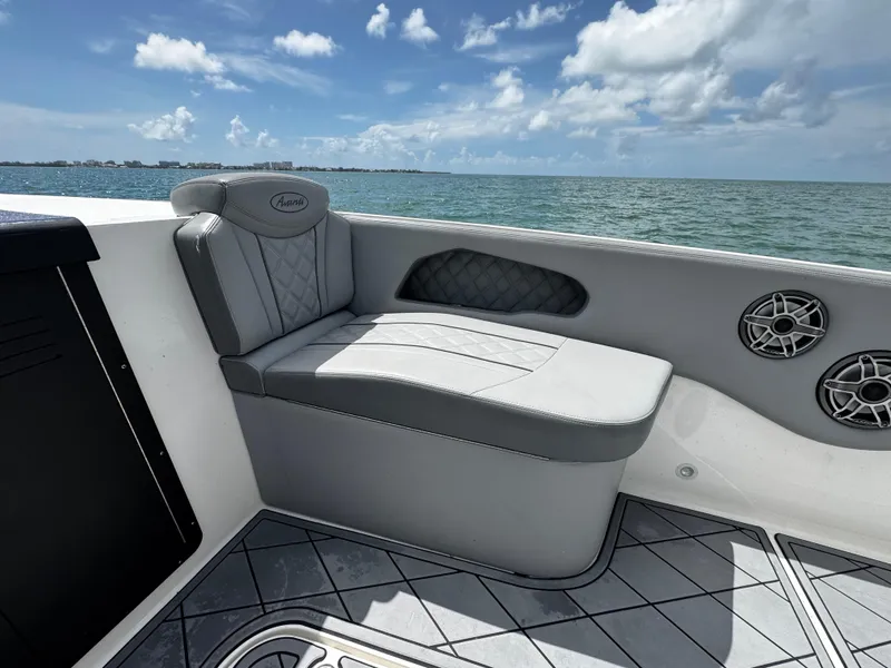 Slide: The Image of Luxury seating on 2023 Avanti 36 boat with ocean view and clear skies. - 16