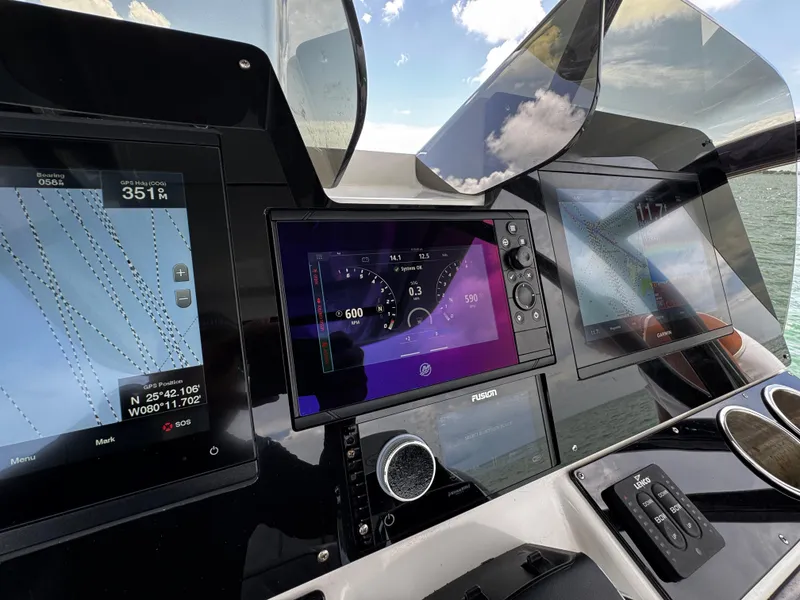 Slide: The Image of Control panel of 2023 Avanti 36 boat with navigation and engine displays. - 26