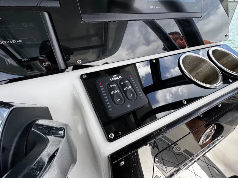 Slide: The Image of Control panel of 2023 Avanti 36 boat with Garmin display and cup holders. - 28