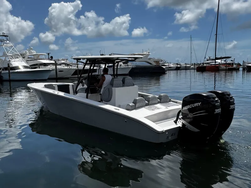 Slide: The Image of 2023 Avanti 36 boat with dual Mercury engines docked in a marina. - 3