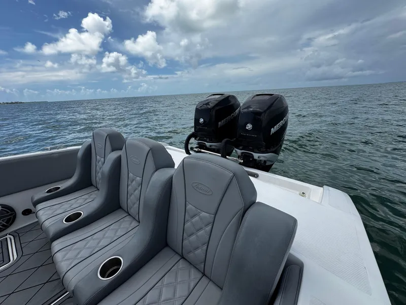 Slide: The Image of 2023 Avanti 36 boat with luxurious seating and dual Mercury outboard engines on open water. - 36