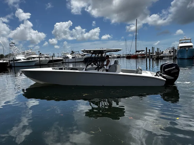 Slide: The Image of 2023 Avanti 36 boat docked in a marina under a cloudy sky. - 4