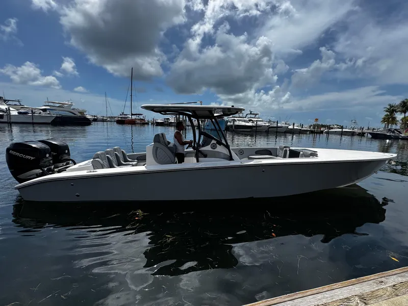 Slide: The Image of 2023 Avanti 36 boat docked, featuring sleek design and powerful Mercury engine. - 5