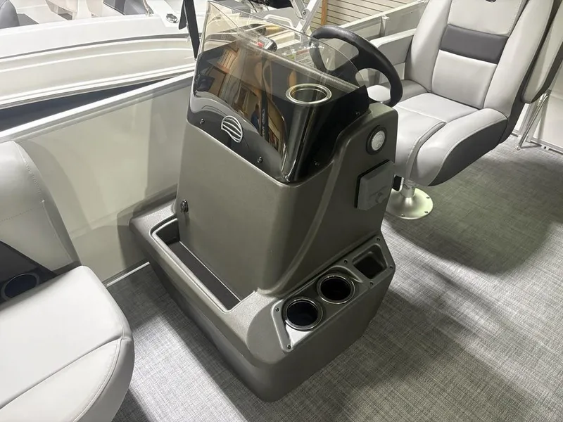 Slide: The Image of 2026 Sun Tracker PARTY BARGE® 16 DLX helm with steering wheel and cup holders. - 15