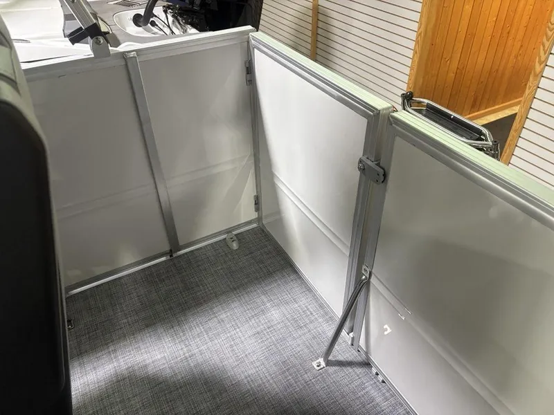 Slide: The Image of 2026 Sun Tracker PARTY BARGE® 16 DLX interior with sleek design and durable flooring. - 17