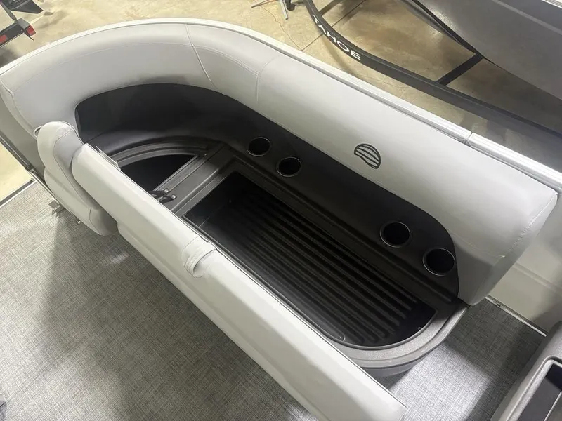 Slide: The Image of 2026 Sun Tracker PARTY BARGE® 16 DLX seating with storage and cup holders. - 2