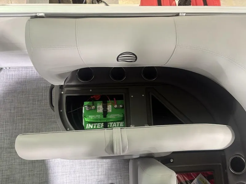 Slide: The Image of 2026 Sun Tracker PARTY BARGE® 16 DLX interior with visible battery compartment. - 20