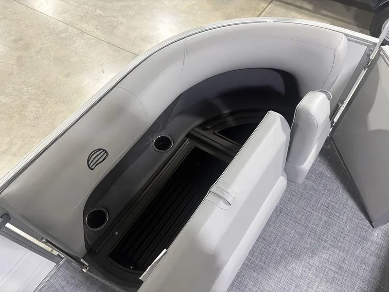 Slide: The Image of 2026 Sun Tracker PARTY BARGE® 16 DLX interior seating with storage and cup holders. - 21