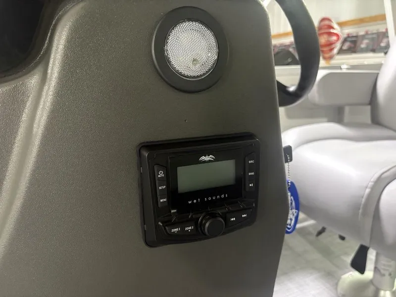 Slide: The Image of 2026 Sun Tracker PARTY BARGE® 16 DLX console with Wet Sounds audio system. - 8