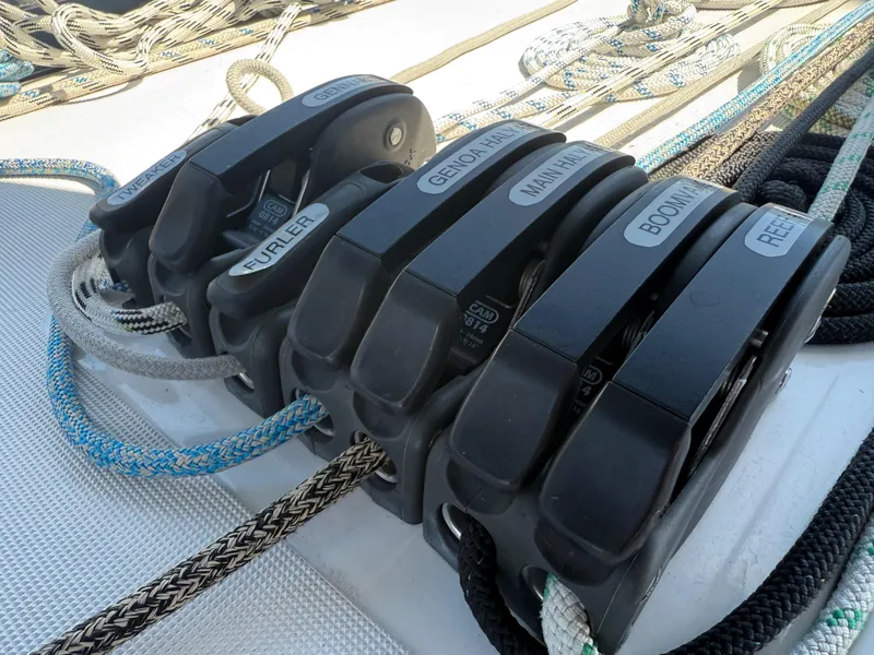 Slide: The Image of Close-up of rope clutches on a 2021 Jeanneau Sun Odyssey 410 sailboat deck. - 21
